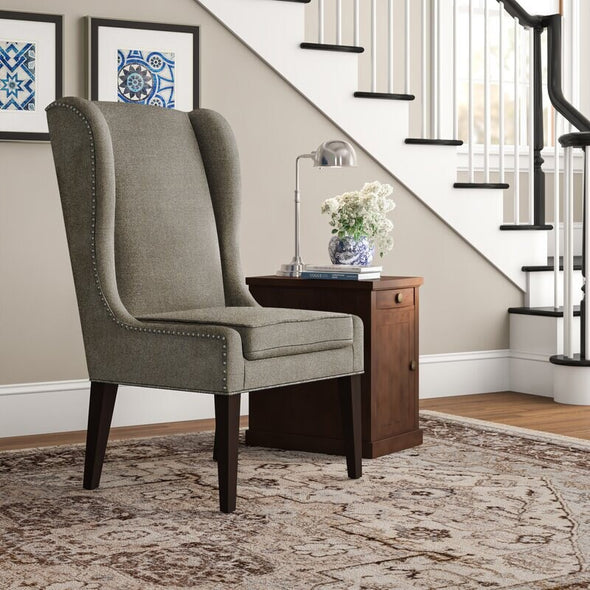 Gray Wingback Chair Adds Stately Style To Any Living Room Or Den. Its Solid and Wood Frame is Founded Atop Four Tapered Legs