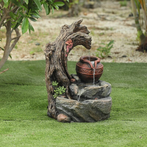 Daulton Resin Tree Stump and Rock Outdoor Fountain Incorporate the Soothing Sights and Sounds of Water into Your Yard, Garden or Landscape