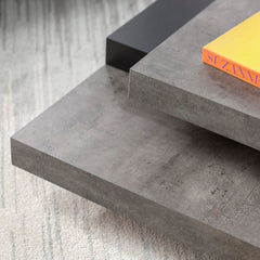 Concrete/Pure Black Akrati Coffee Table Supports up to 33 lbs. Fusing Function and Sculptural Style