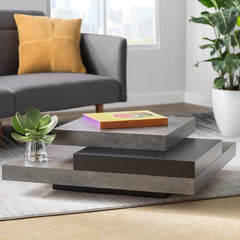 Concrete/Pure Black Akrati Coffee Table Supports up to 33 lbs. Fusing Function and Sculptural Style